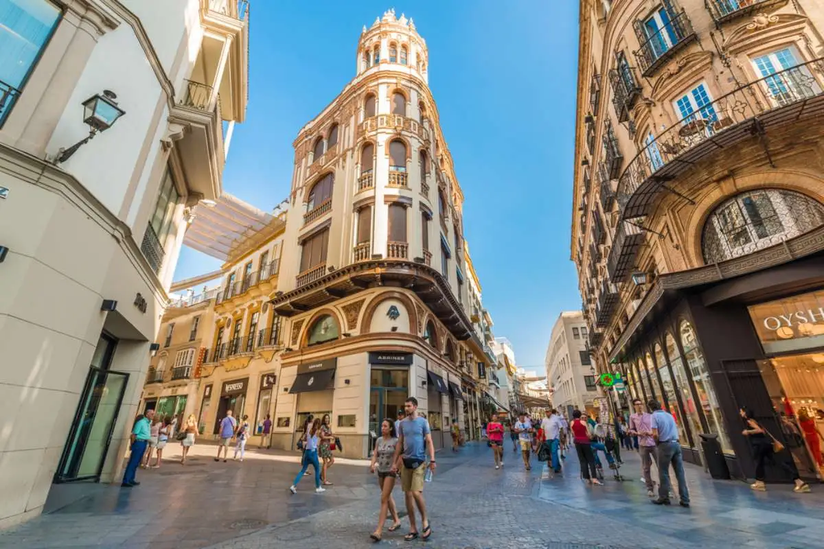 SEVILLE, ES - JULY 26, 2017: Calle Sierpes is a traditional and busy shopping street in the Spanish city of Seville, Andalusia, Spain.